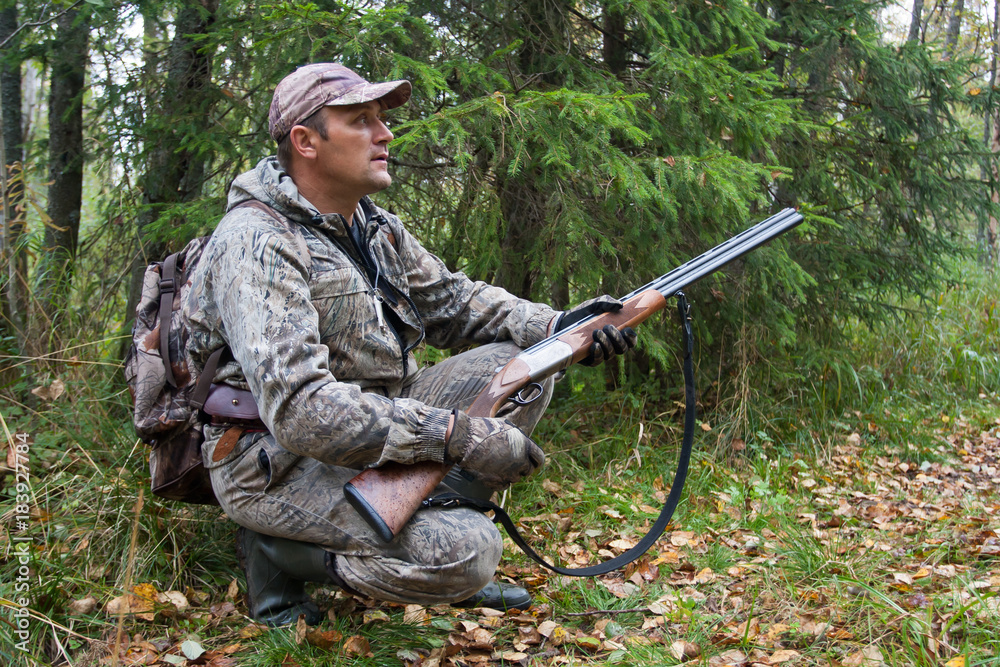 hunter waiting a prey in the forest hunter waiting a prey in the forest