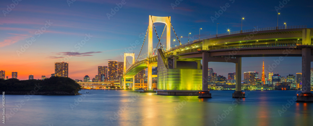 Rainbow Bridge Panorama, Tokyo. Panoramic cityscape image of Tokyo, Japan with Rainbow Bridge during sunset. Rainbow Bridge Panorama, Tokyo. Panoramic cityscape image of Tokyo, Japan with Rainbow Bridge during sunset.