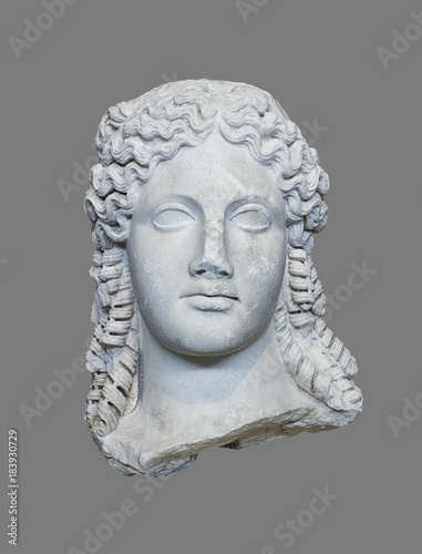 Ancient Agyptian women head isolated on grey background 