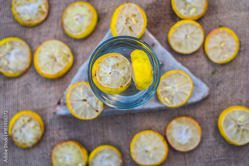 Lemon water/lemonade with slices of lemons/Citrus × limon.