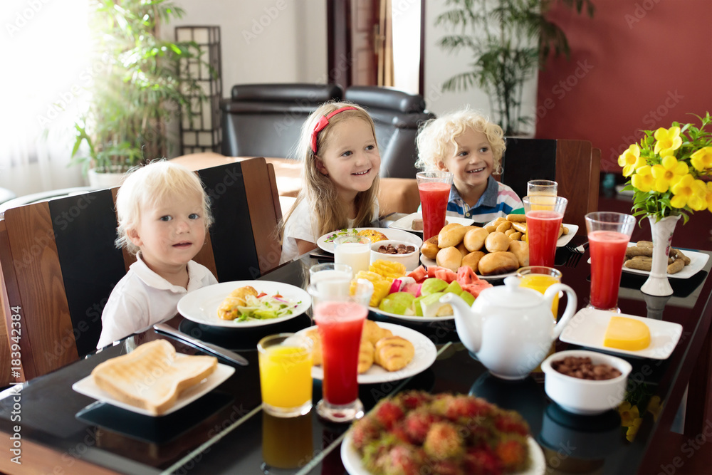 Healthy family breakfast for mother and kids.