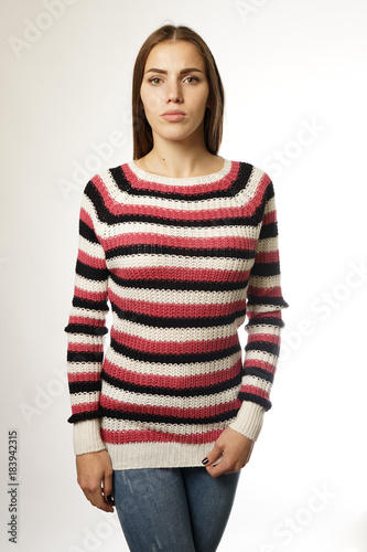 woman in a striped sweater on a white background