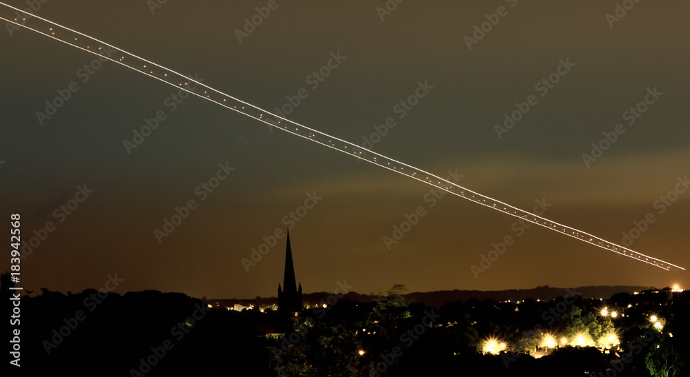 Obraz premium Long exposure airplane landing