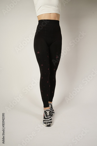 Woman's legs in a black sport pants. photo