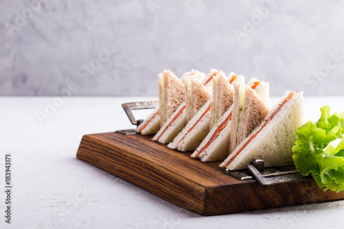 Fényképezés English tea sandwiches platter on wooden board