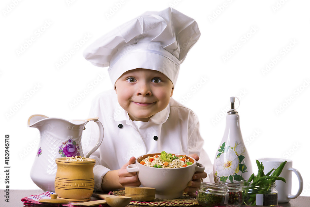 funny boy chef prepares porridge with vegetables funny boy chef prepares porridge with vegetables
