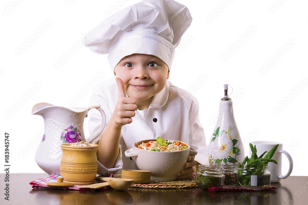 funny boy chef prepares porridge with vegetables funny boy chef prepares porridge with vegetables