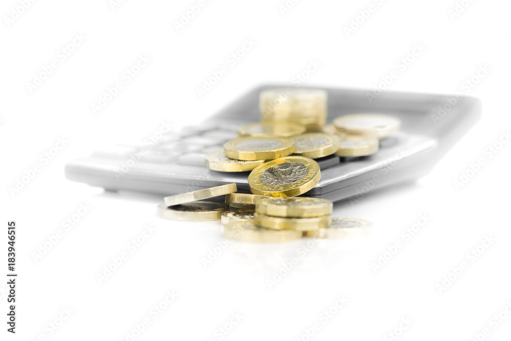 Pound Coins with Calculator, close up on White Blown Out Background
