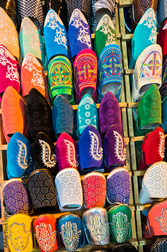 Colorful Moroccan oriental shoes aligned in a shop at medina of Fez, Morroco, Africa © banepetkovic
