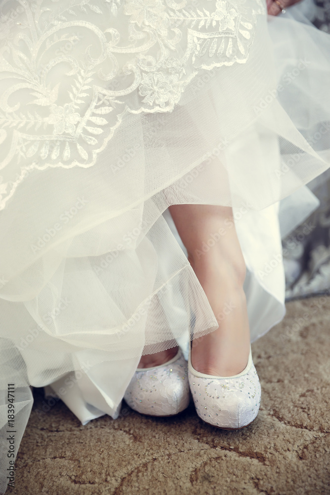 close-up of the bride's legs, shoes