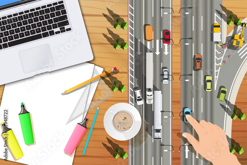 top view wood table with small road and small cars hand touching small car