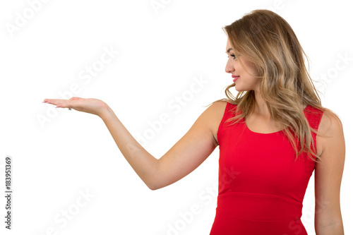 Woman pointing at sign. Young beautiful sexy woman showing copy space on empty blank sign or gift card.