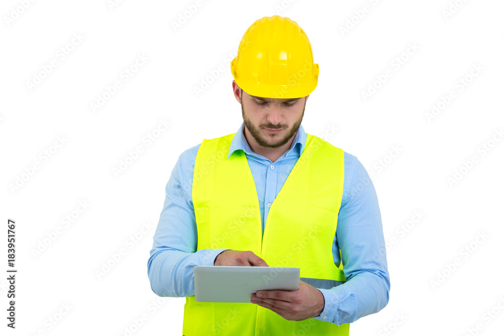 Handsome engineer working with a tablet pc, isolated on white Handsome engineer working with a tablet pc, isolated on white