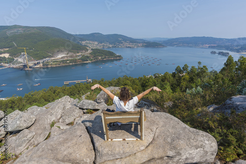 Chica en un banco de Redondela (Pontevedra, España). photo