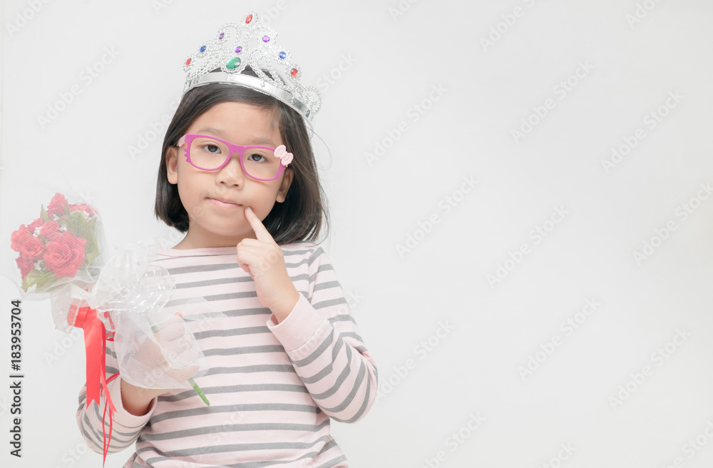 Cute asian girl wearing a crown and holding rose bouquet Cute asian girl wearing a crown and holding rose bouquet