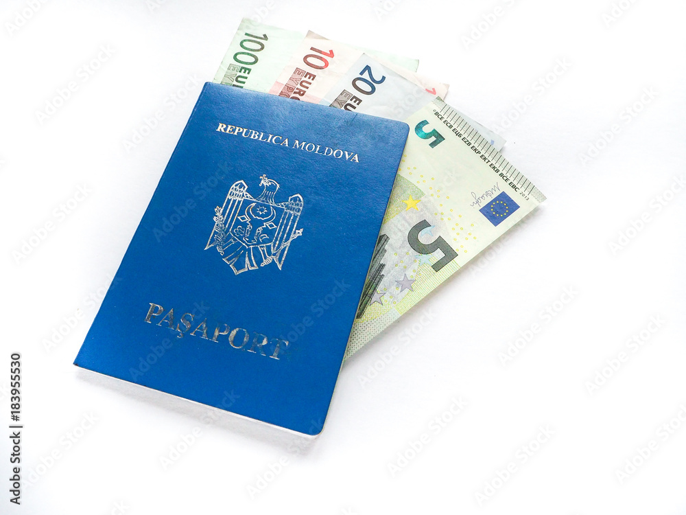 Moldovan passport with Euro banknotes on white background Moldovan passport with Euro banknotes on white background