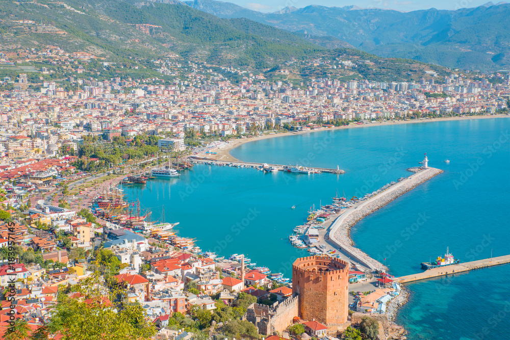 Landscape with marina and Red tower in Alanya peninsula, Antalya district, Turkey