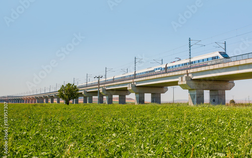 View of a high-speed train crossing a viaduct