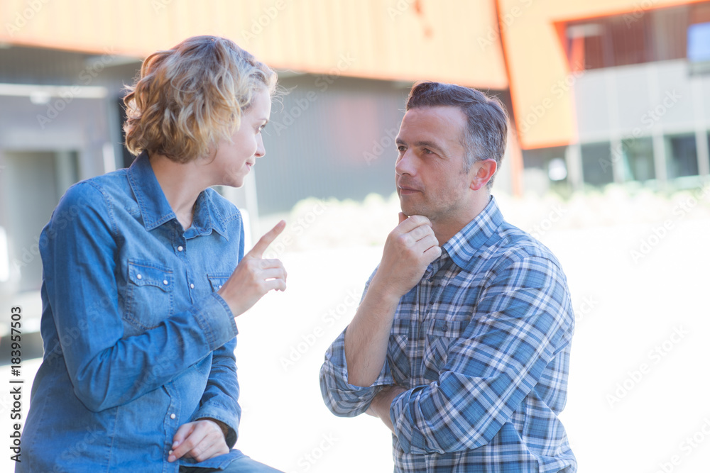 man and woman in discussion woman pointing finger man and woman in discussion woman pointing finger