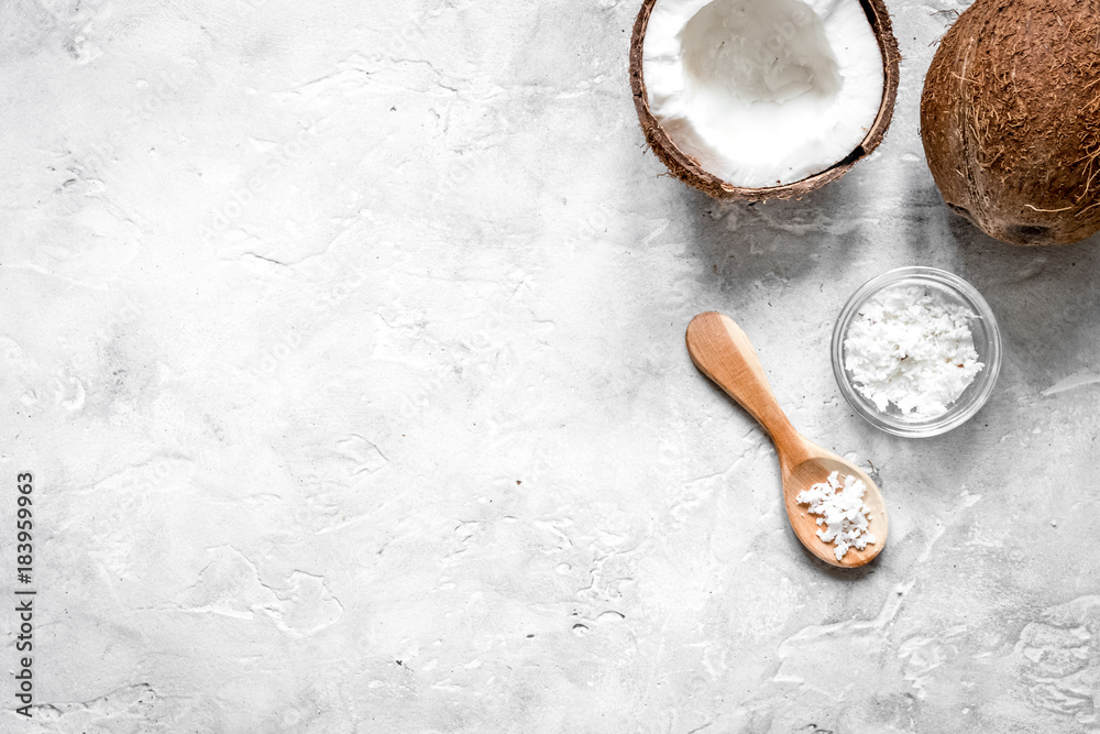 fresh coconut with cosmetic oil in jar on gray background top vi fresh coconut with cosmetic oil in jar on gray background top vi