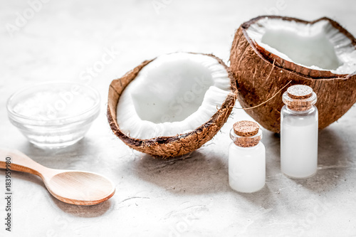 coconut oil for body care in cosmetic concept on white desk