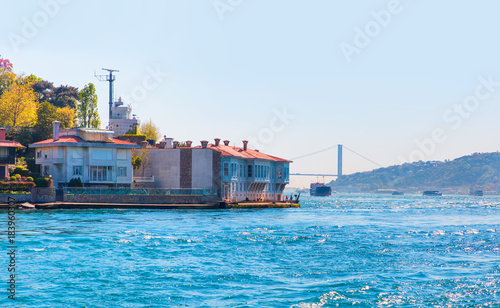 Large cargo container ship passing through Bosphorus, Istanbul, Turkey photo