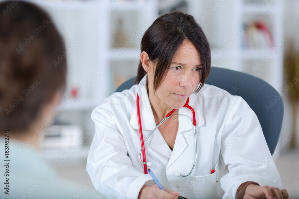portrait of a beautiful female doctor working in her office portrait of a beautiful female doctor working in her office