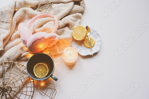 Wallpaper Mural Cozy winter morning at home. Hot tea with lemon, knitted sweaters and modern interior details. Flat lay still life composition. Torontodigital.ca