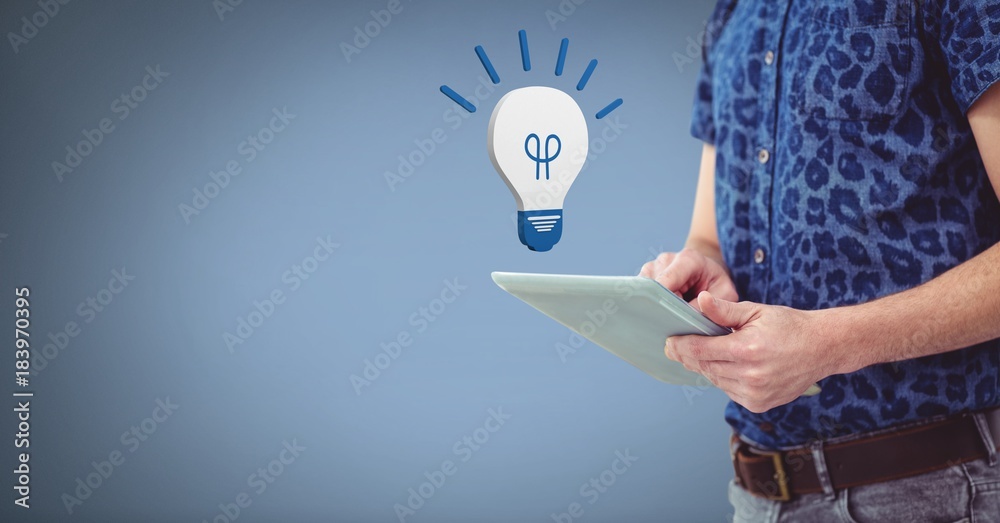 Hand holding tablet with 3D light bulb idea icon Hand holding tablet with 3D light bulb idea icon