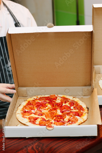 Pizza in craft cardboard bo...