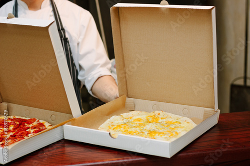 Pizza in craft cardboard bo...