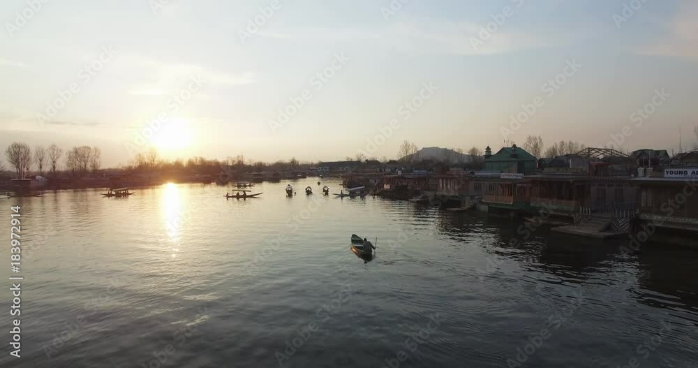 People ride boats on Jhelum River at sunset, aerial People ride boats on Jhelum River at sunset, aerial