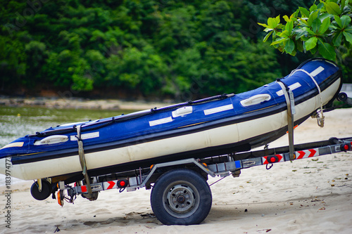 The rubber boat on the trailer.