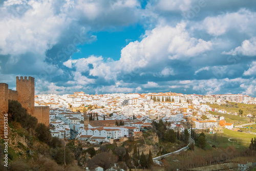 Aerial panoramic view of Ronda, tradational white houses with tile roofs on the hill and its surroundings, one of most famous white villages (pueblos blancos) in Malaga province, Andalusia, Spain.