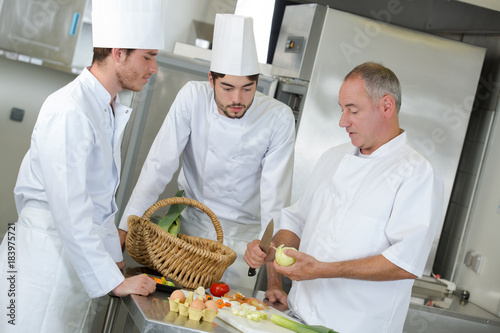 Photos interns of the chef observing his work