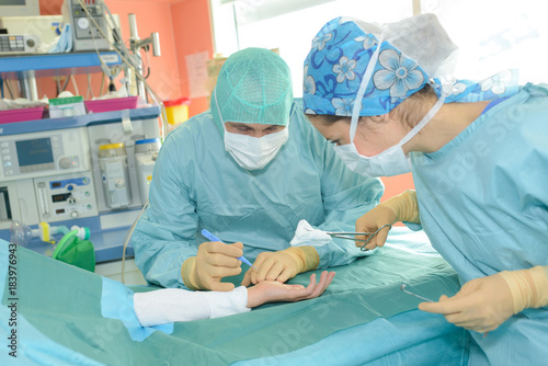 surgery team operating in a surgical room