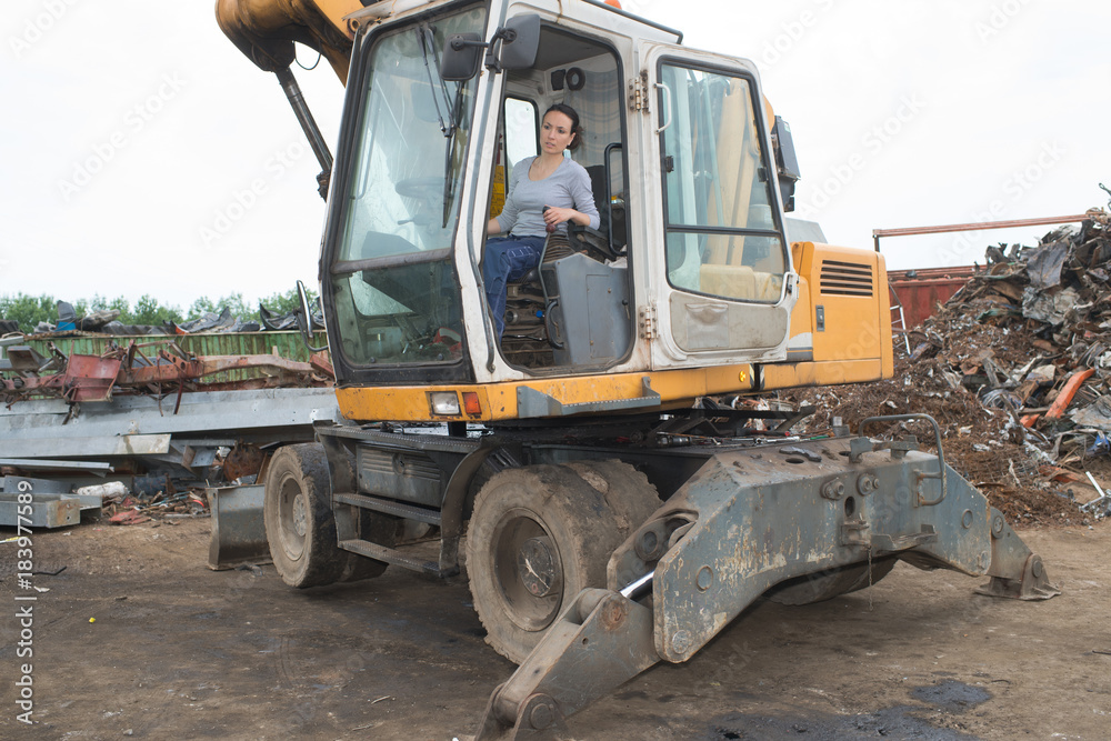 Fototapeta premium female driver in her truck in landfill