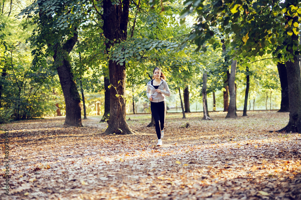 Fit woman jogging in park