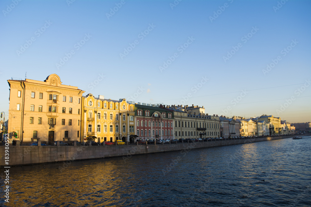 Embankment of Fontanka river in the autumn in the rays of light in Saint Petersburg