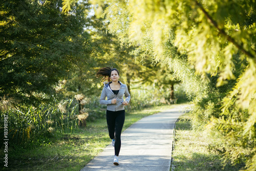 Beautiful woman jogging in nature © NDABCREATIVITY
