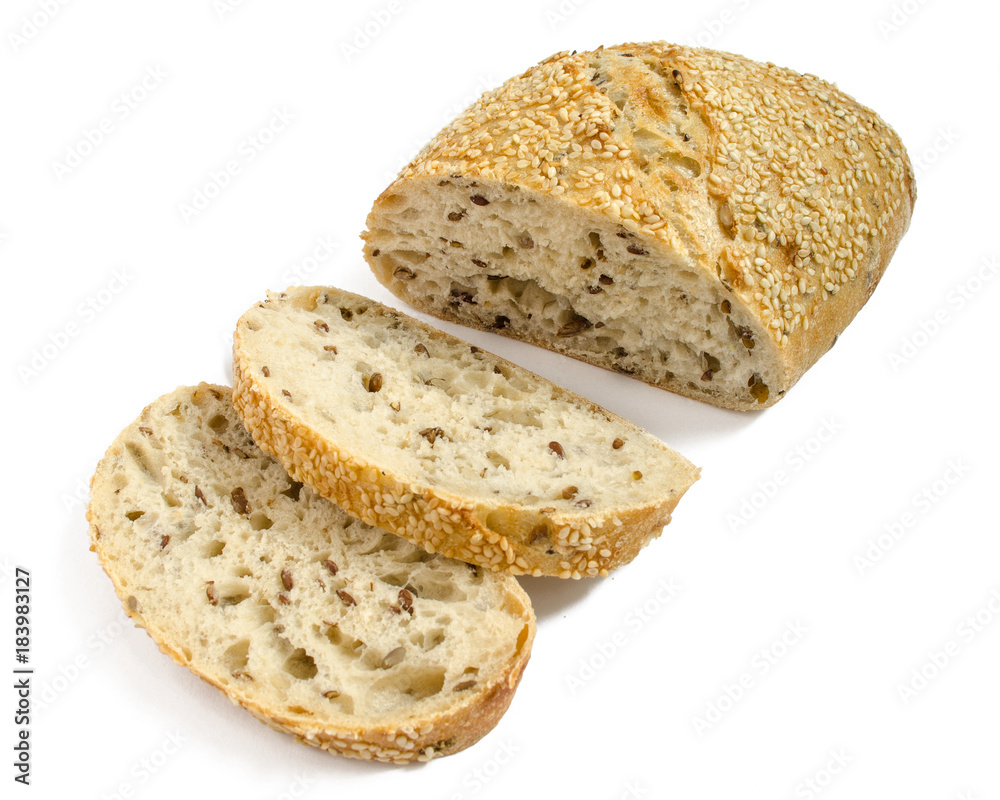 Sesame bread with different seeds and sliced isolated on white background