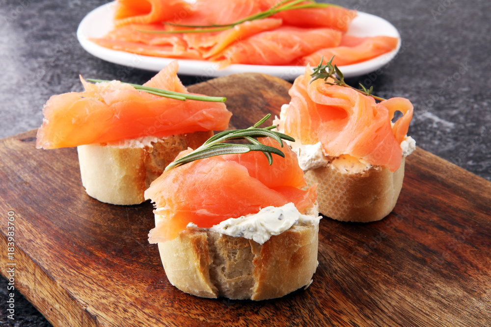 Bread with smoked salmon and cream cheese and herbs. Bread with smoked salmon and cream cheese and herbs.