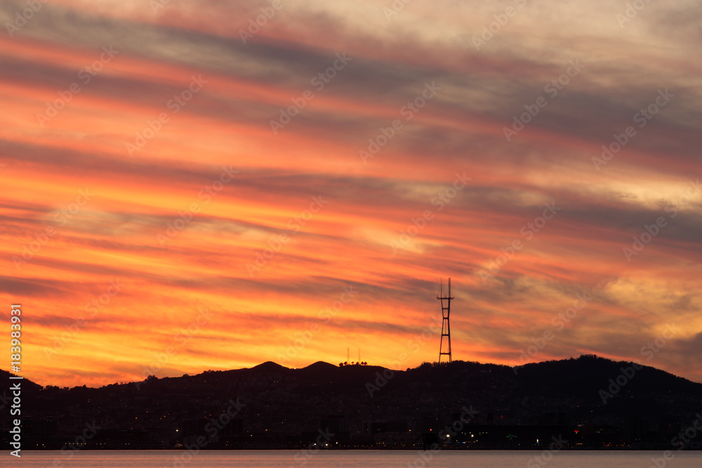 Sutro Tower Sunset as seen from Port of Oakland. Mount Sutro, San Francisco, California, USA.