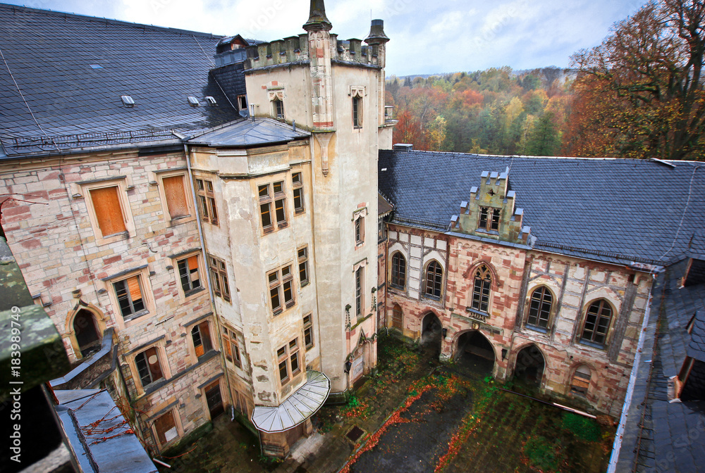 Abandoned castle, located in Thuringia a few hundred kilometers from Berlin.   View of the courtyard from the roof.