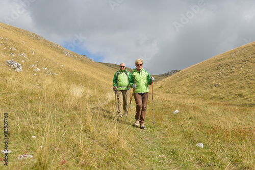 Senior tourist couple hiking at the beautiful mountains © FS-Stock