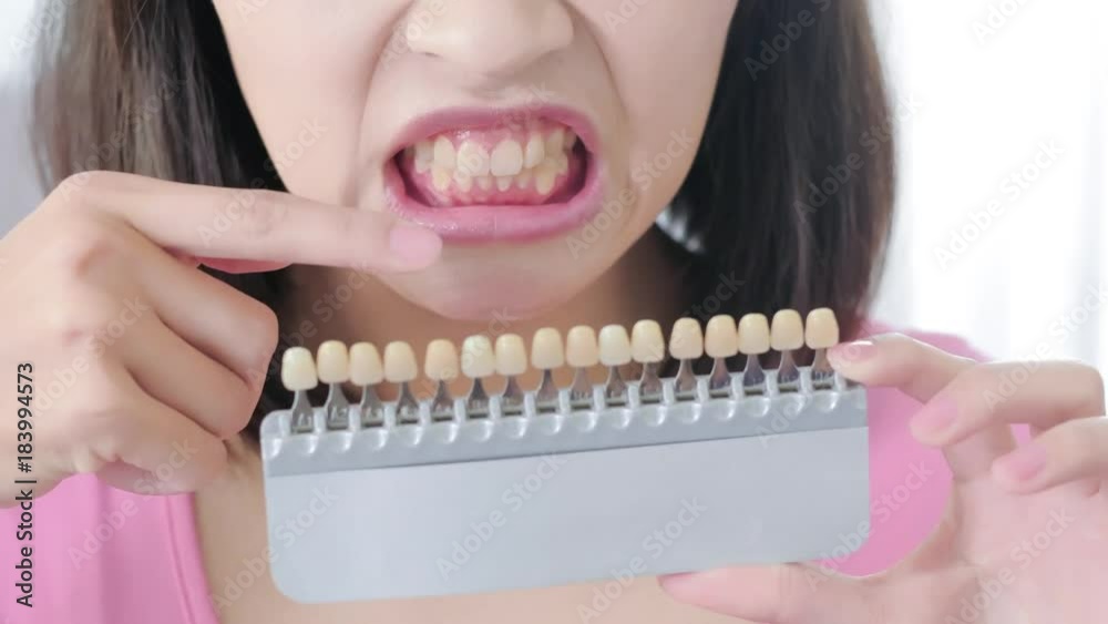 woman take tooth color palette