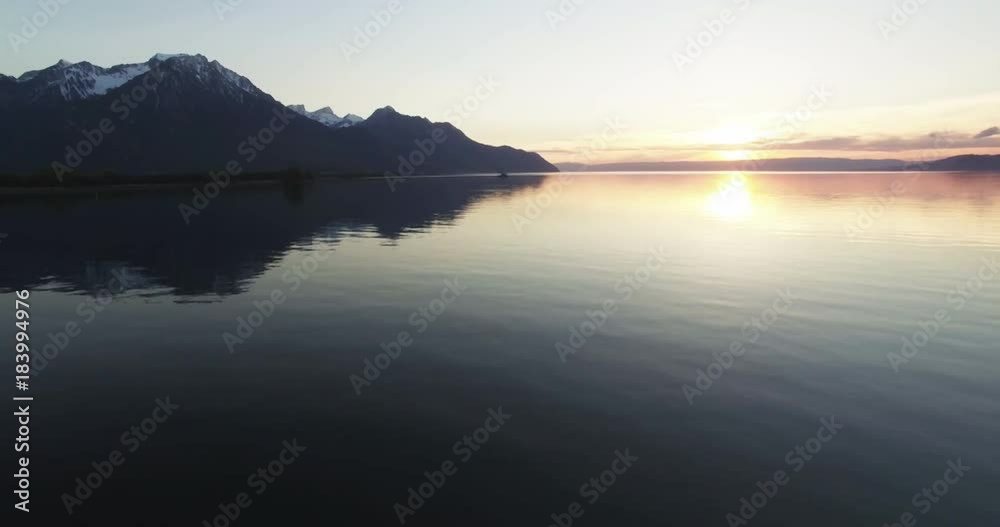 Sun sets over Lake Geneva in Switzerland, aerial Sun sets over Lake Geneva in Switzerland, aerial