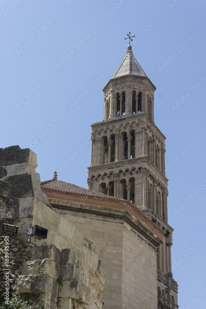 Bell tower of Saint Domnius cathedral in Split, with fortified city walls