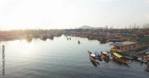 Aerial, boats on Jhelum River at sunset