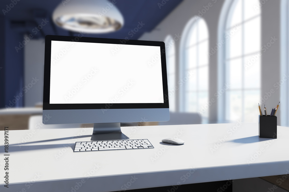White computer screen on a white office table blur White computer screen on a white office table blur